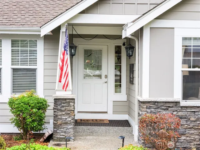 a front view of a house with garden