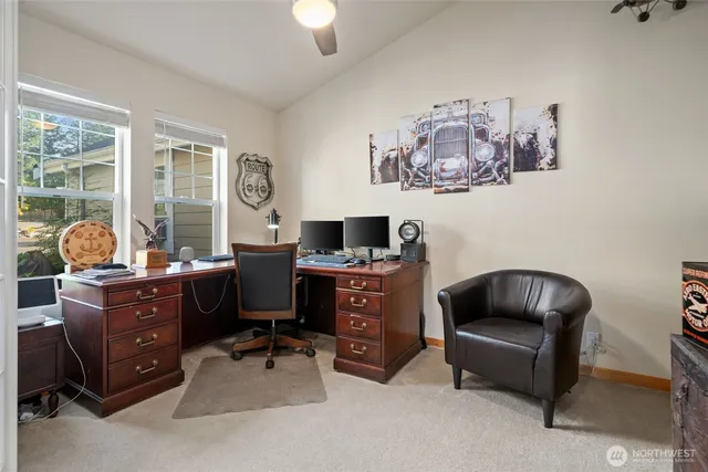 a workspace with furniture and a window