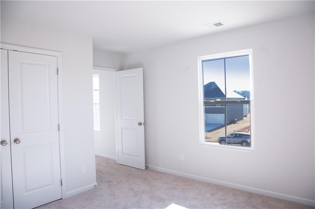 19 Springwood Lane Dawsonville, GA 30534 - Photo 16 of 23 a view of an empty room and closet