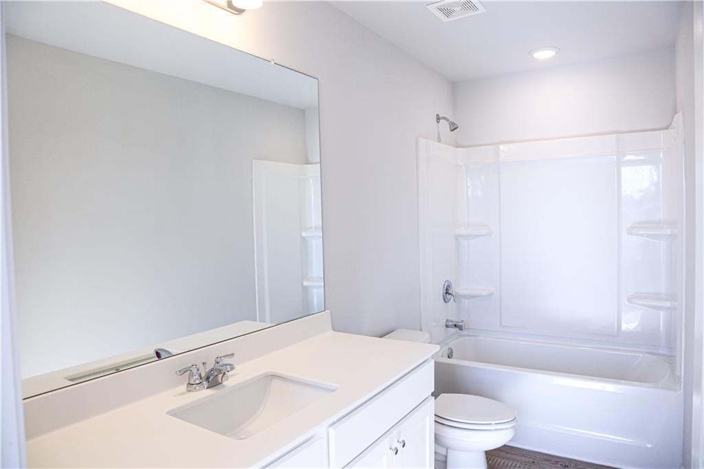 19 Springwood Lane Dawsonville, GA 30534 - Photo 18 of 23 a bathroom with a sink a toilet and shower