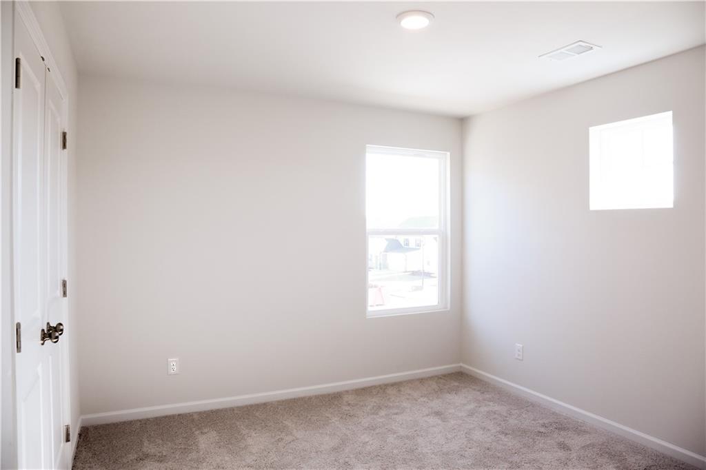 19 Springwood Lane Dawsonville, GA 30534 - Photo 19 of 23 an empty room with windows