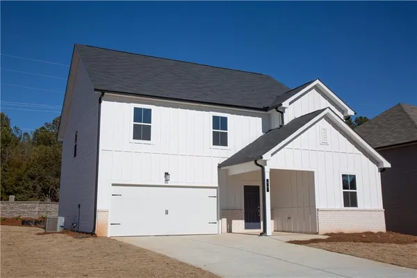 a front view of a house with garage