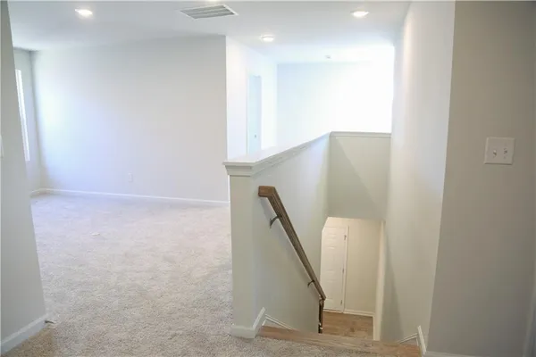 a kitchen with granite countertop a sink a stove and microwave