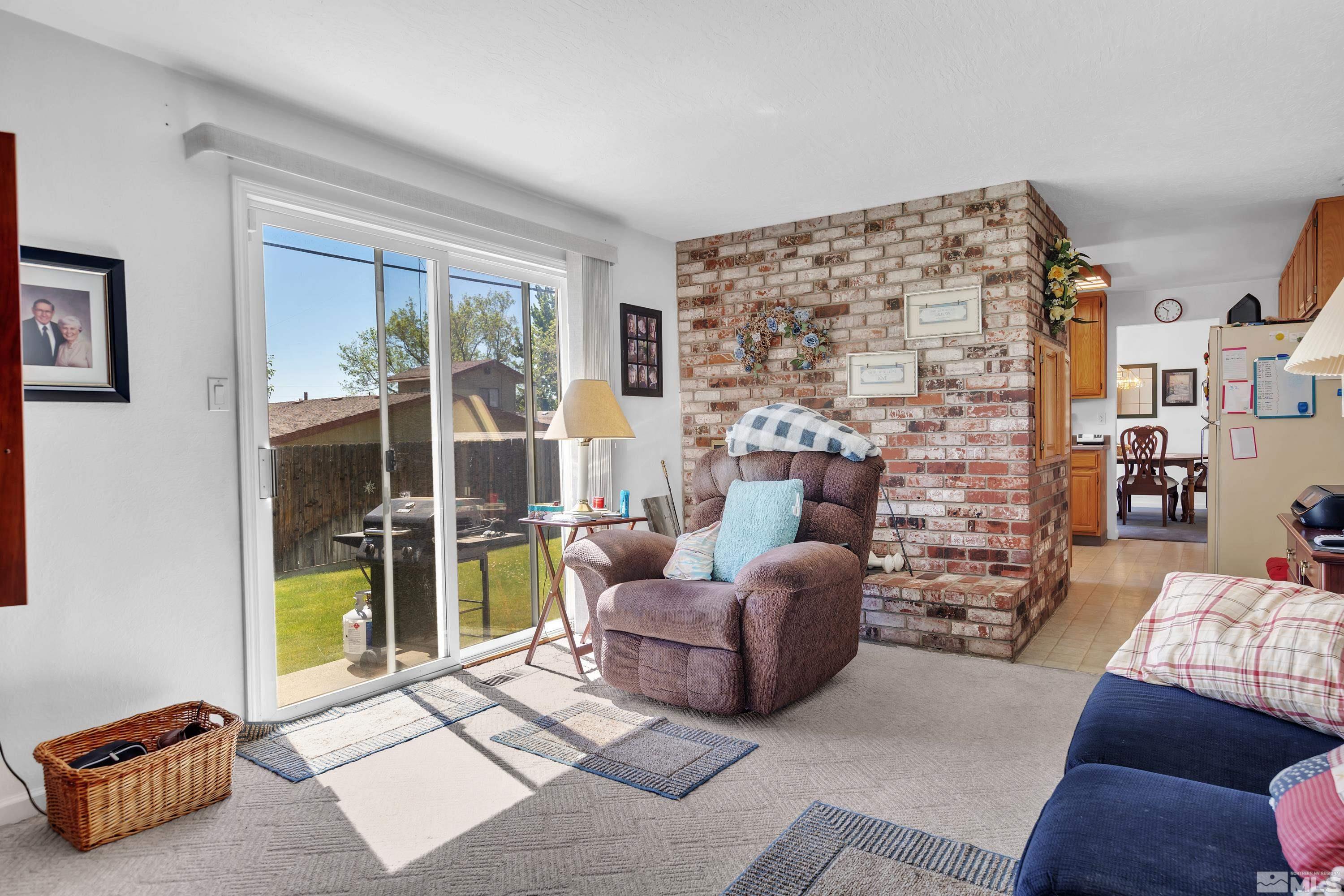 620 Nancy Circle Reno, NV 89503 - Photo 15 of 36 a living room with furniture and a fireplace