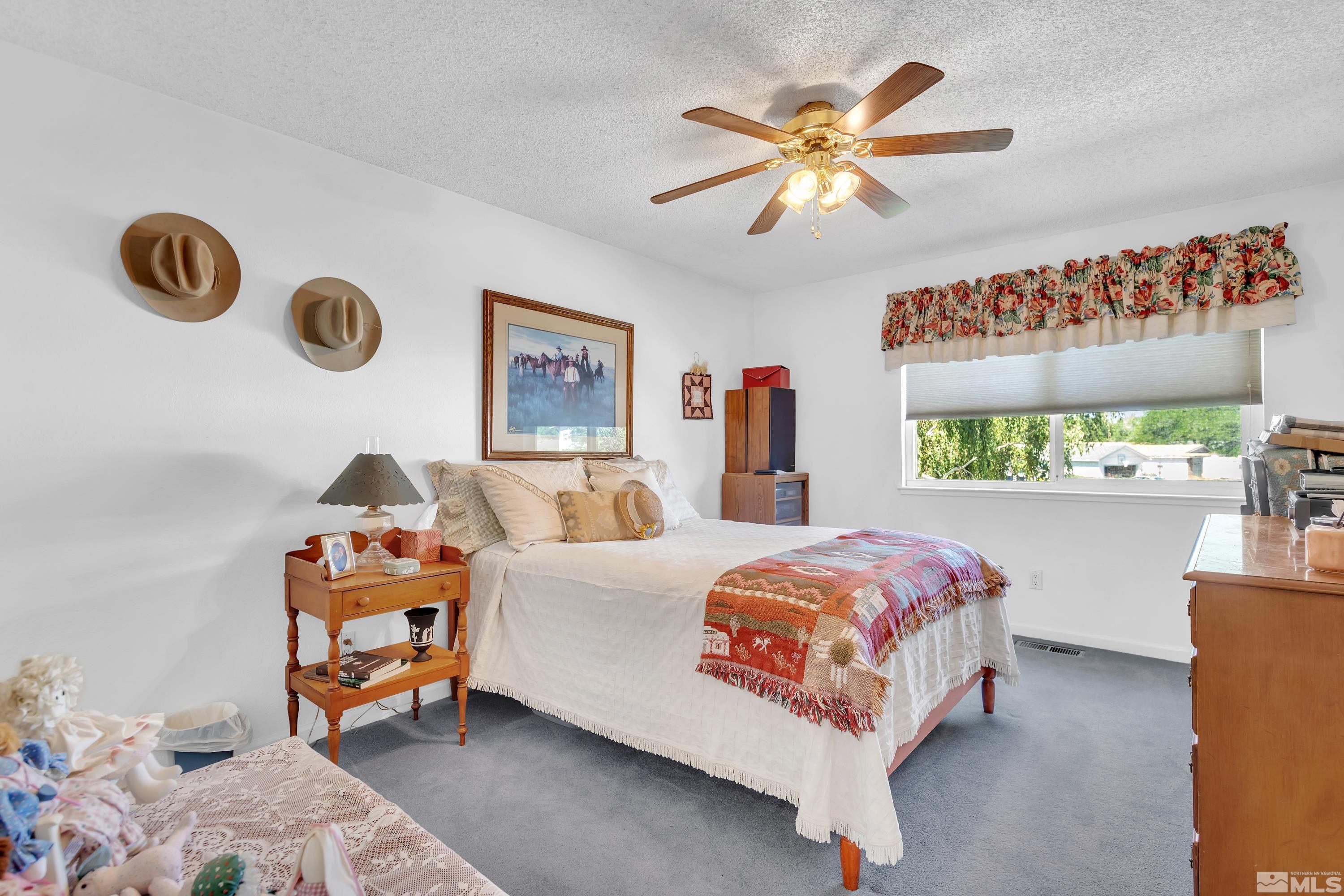 620 Nancy Circle Reno, NV 89503 - Photo 21 of 36 a bed room with a bed and a window
