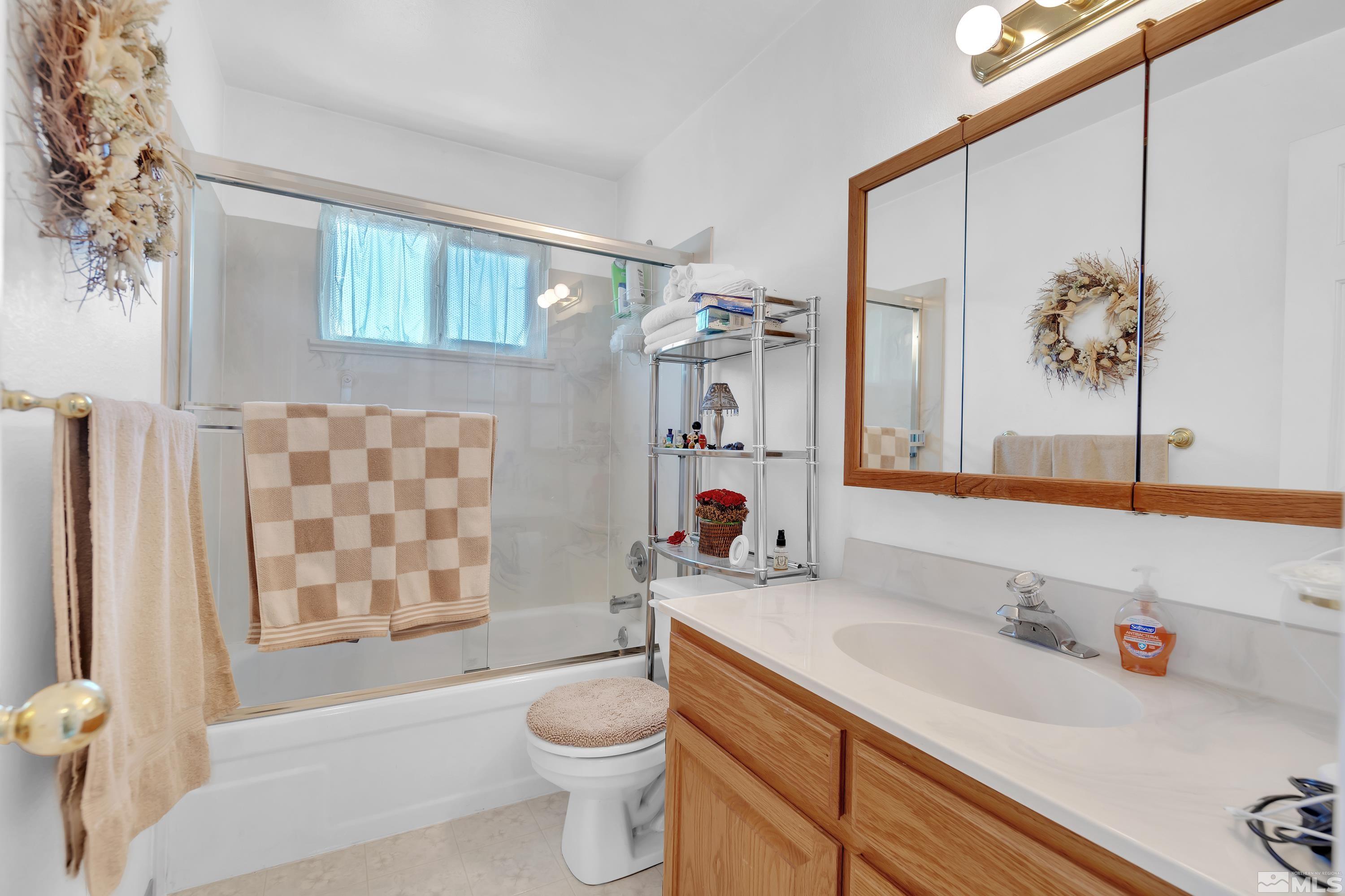 620 Nancy Circle Reno, NV 89503 - Photo 22 of 36 a bathroom with a sink toilet and shower