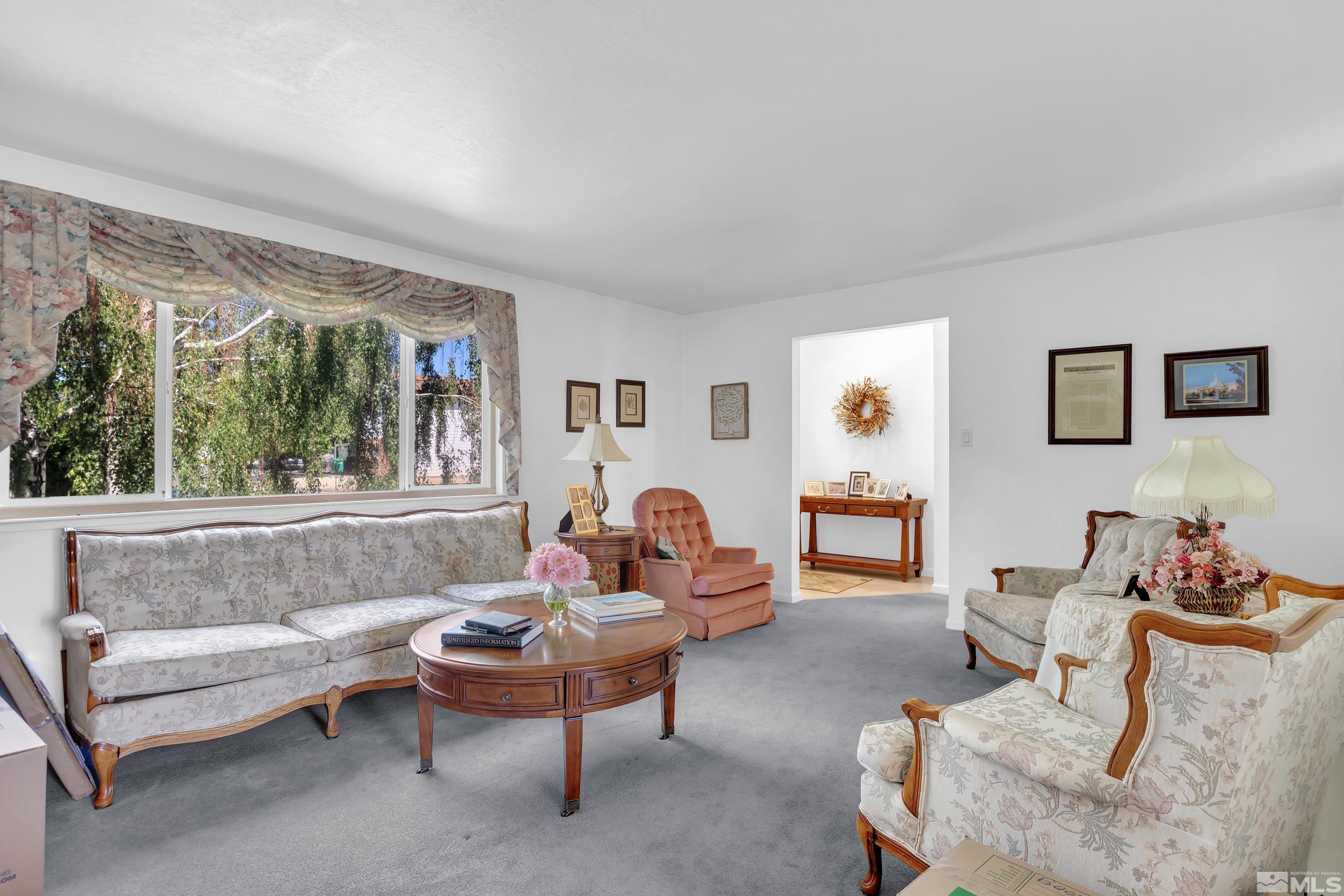 620 Nancy Circle Reno, NV 89503 - Photo 3 of 36 a living room with furniture and a large window