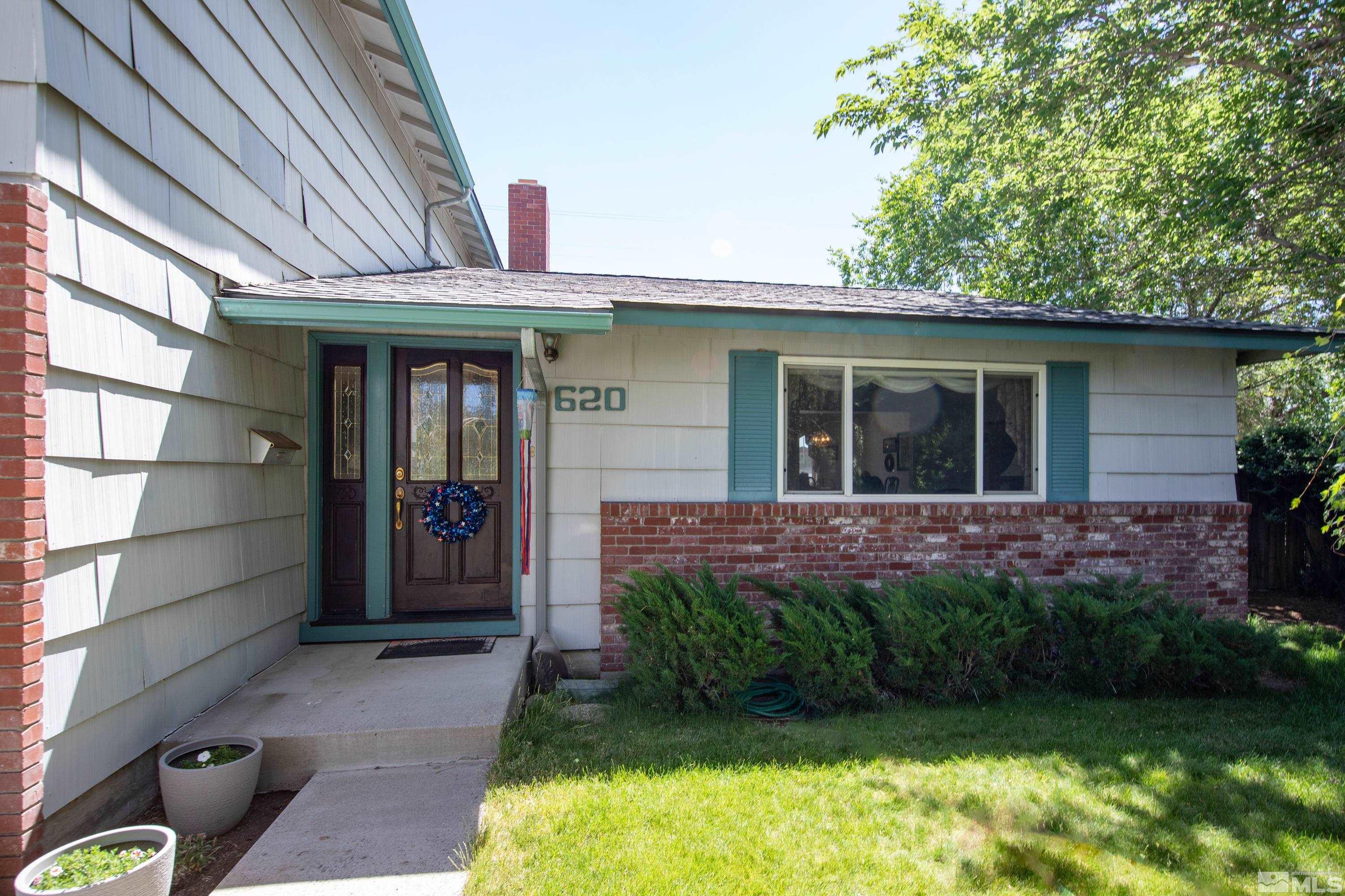 620 Nancy Circle Reno, NV 89503 - Photo 34 of 36 a view of a house with a yard and plants