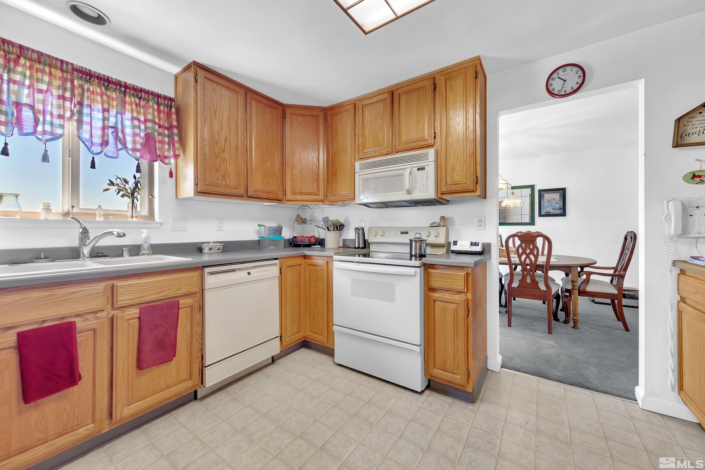 620 Nancy Circle Reno, NV 89503 - Photo 5 of 36 a kitchen filled counter top space a sink cabinets and appliances