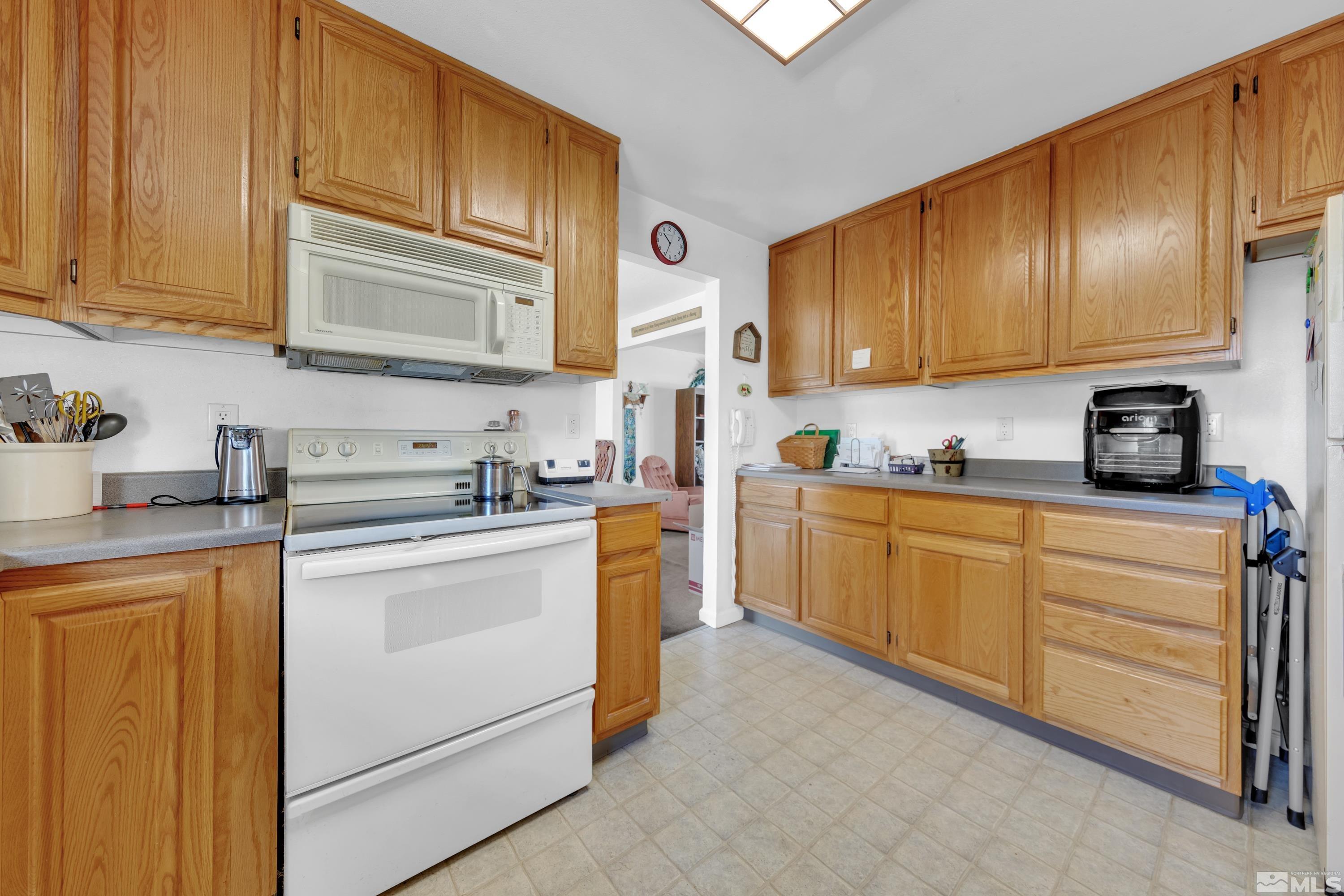 620 Nancy Circle Reno, NV 89503 - Photo 6 of 36 a kitchen with cabinets stainless steel appliances and a sink