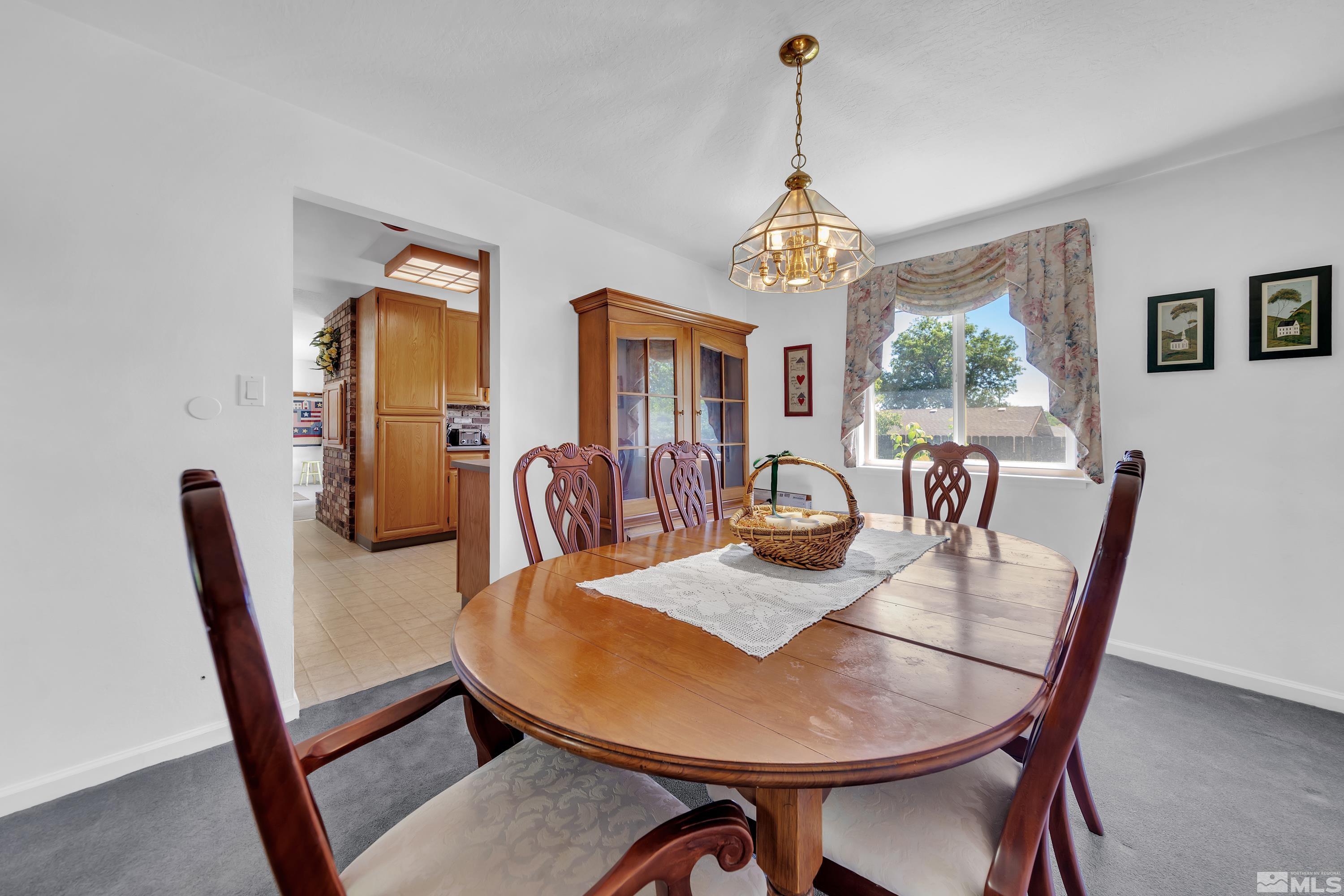 620 Nancy Circle Reno, NV 89503 - Photo 9 of 36 a view of a dining room with furniture window and wooden floor