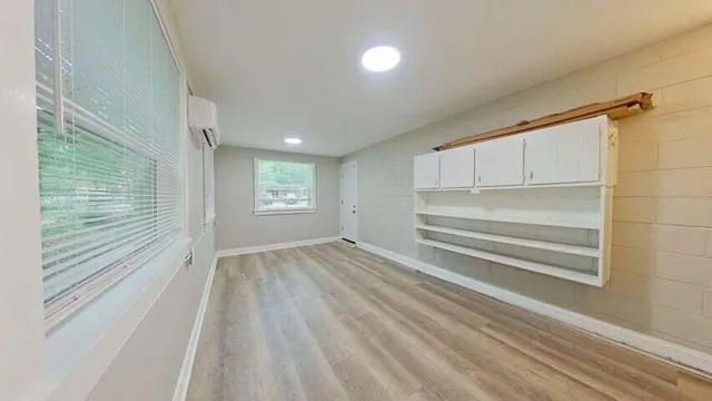 a view of an empty room with a window