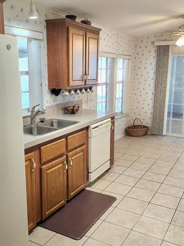 a utility room with cabinets washer and dryer