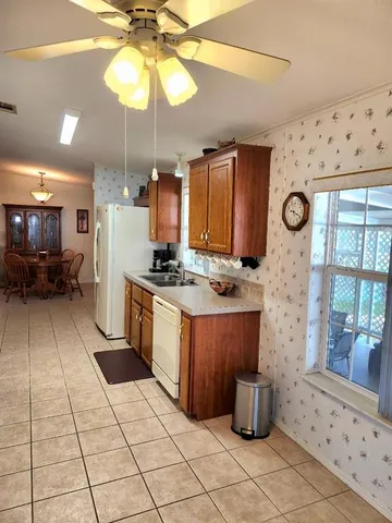 a bedroom with a bed window and couch