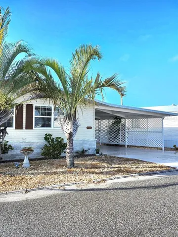 a view of a patio with table and chairs