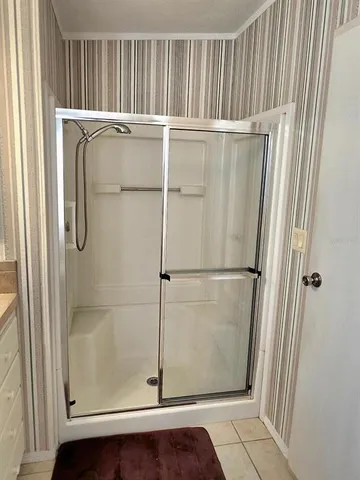 a living room with a couch and a rug