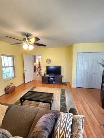 a view of a house with a backyard