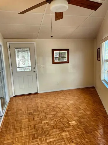 a view of a park with large trees