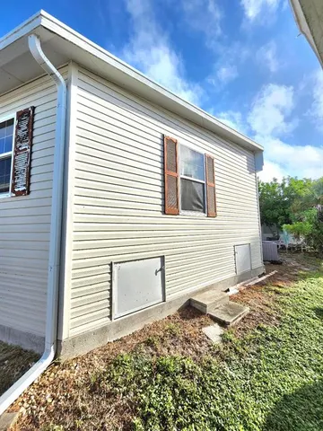 a view of a porch with wooden floor and fence