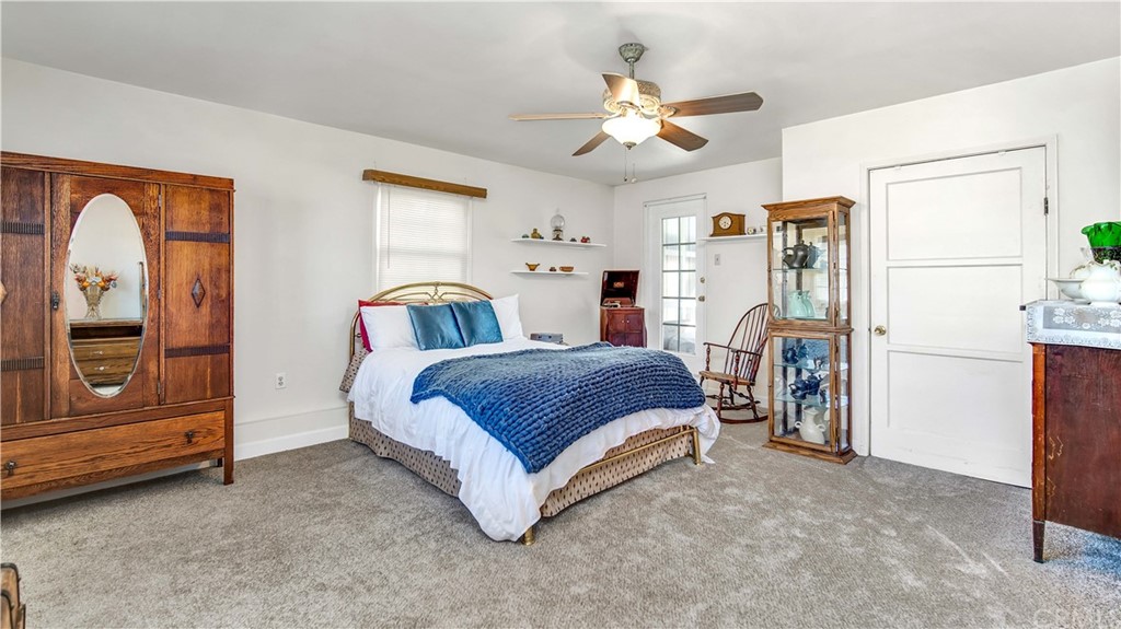 3708 West Victory Boulevard Burbank, CA 91505 - Photo 11 of 24 a spacious bedroom with a bed and a chandelier