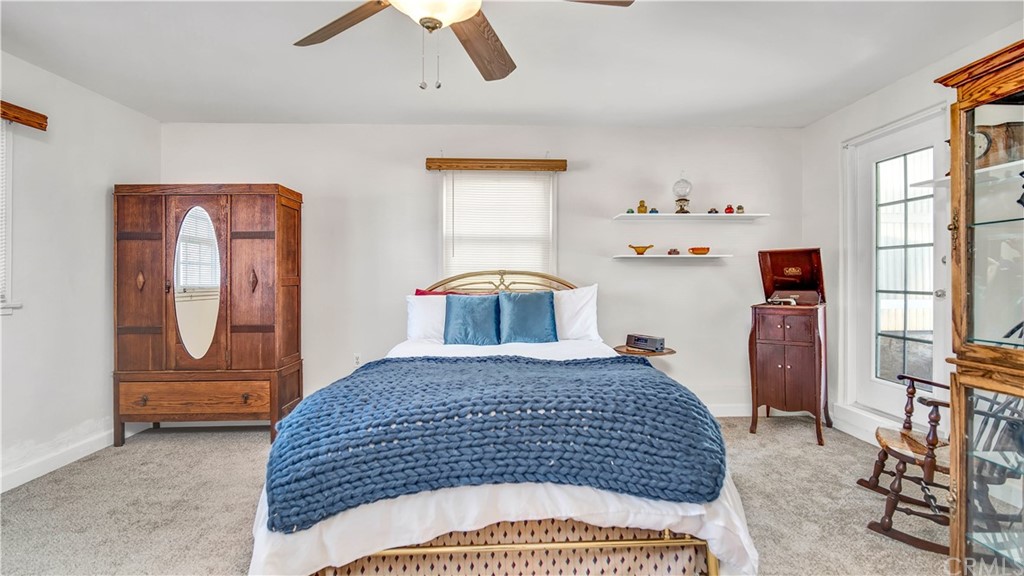 3708 West Victory Boulevard Burbank, CA 91505 - Photo 12 of 24 a bedroom with a bed and dresser with mirror