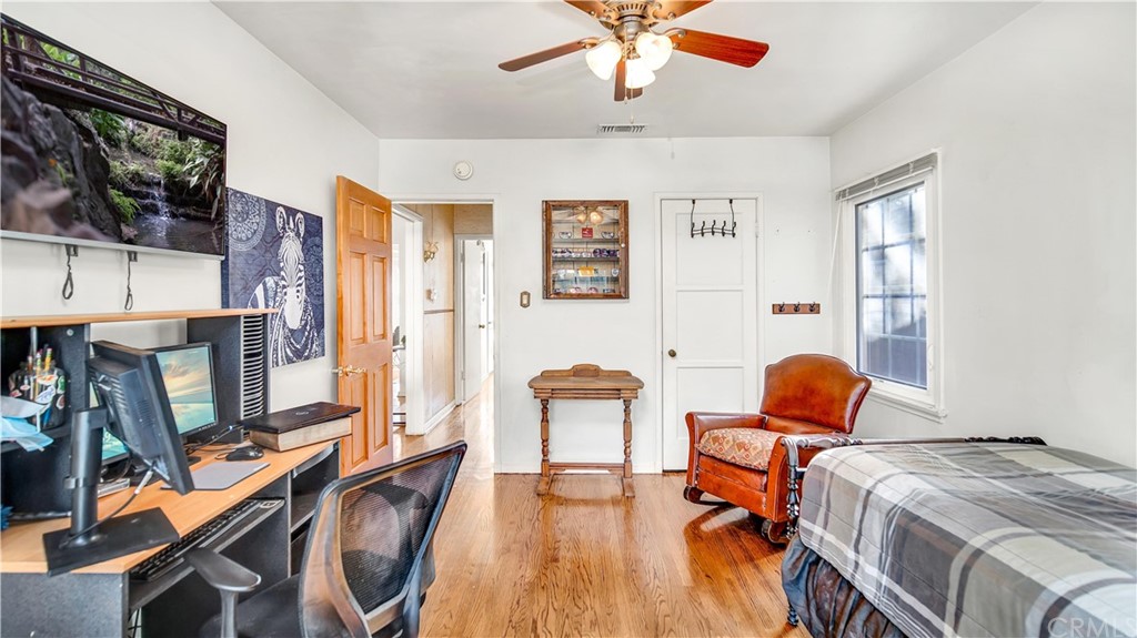 3708 West Victory Boulevard Burbank, CA 91505 - Photo 18 of 24 a bedroom with furniture and a flat screen tv