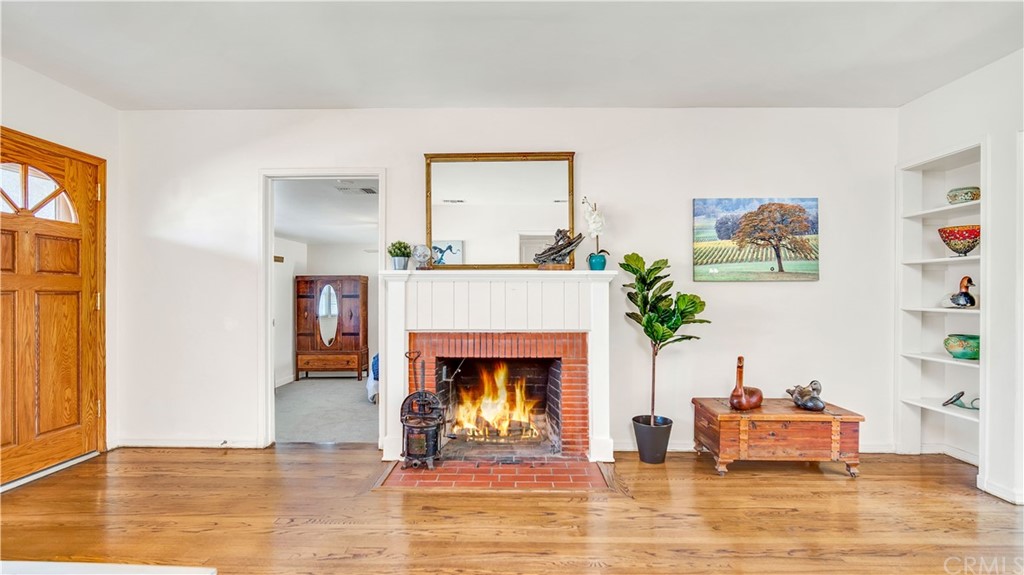 3708 West Victory Boulevard Burbank, CA 91505 - Photo 5 of 24 a living room with furniture and a fireplace
