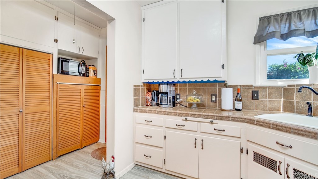 3708 West Victory Boulevard Burbank, CA 91505 - Photo 10 of 24 a kitchen with granite countertop a sink and cabinets