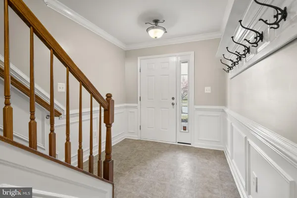 a view of an entryway with wooden floor