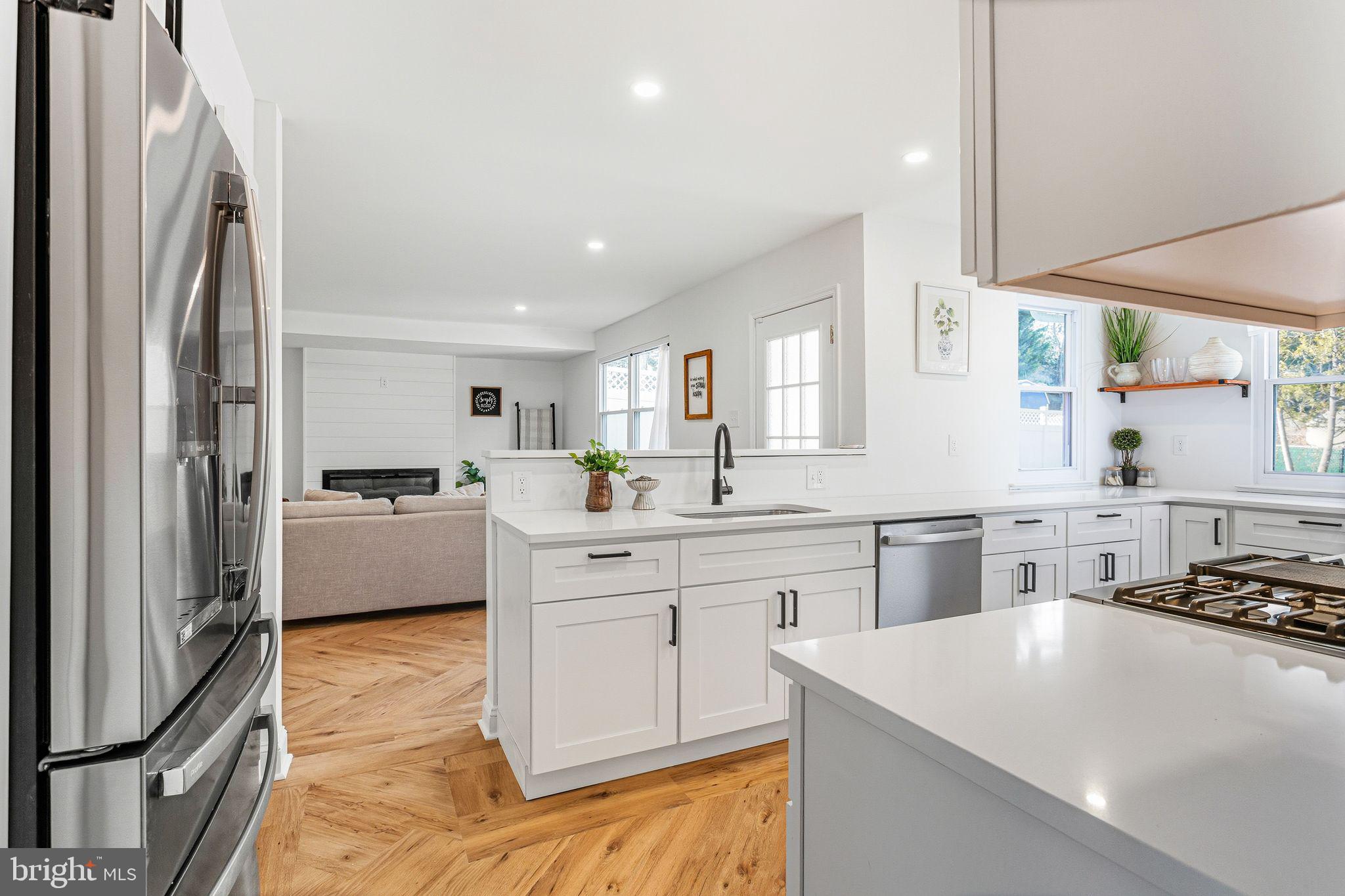 15162 Wayside Road Philadelphia, PA 19116 - Photo 12 of 34 a kitchen with stainless steel appliances a refrigerator sink and cabinets