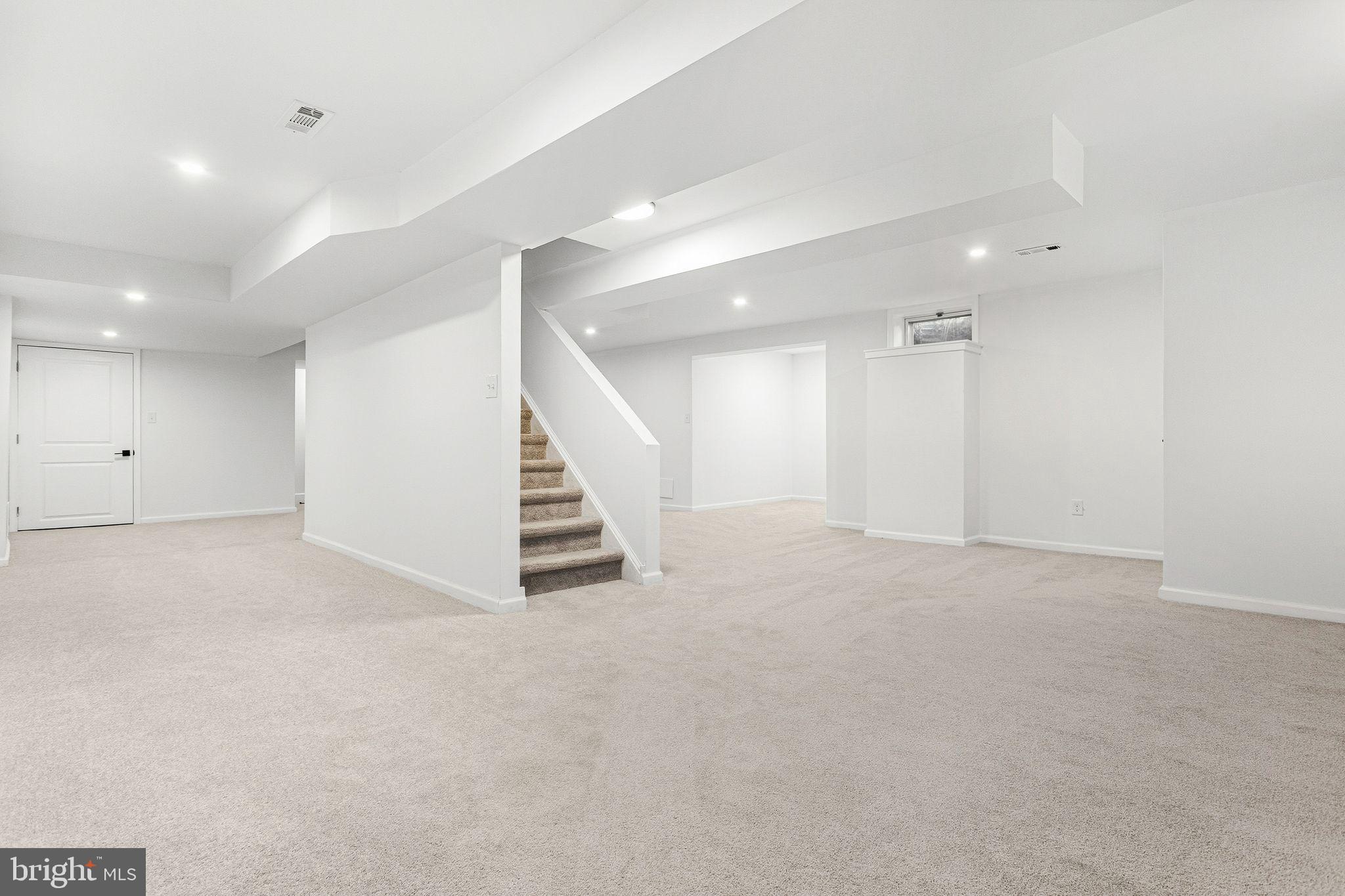 15162 Wayside Road Philadelphia, PA 19116 - Photo 30 of 34 an empty room with white walls and stairs