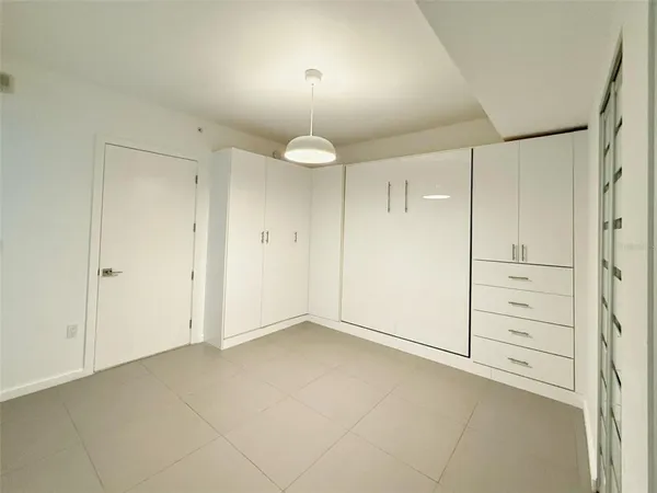 a kitchen with stainless steel appliances a refrigerator sink and cabinets