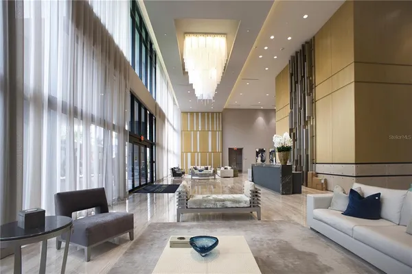 a living room with furniture and a large window