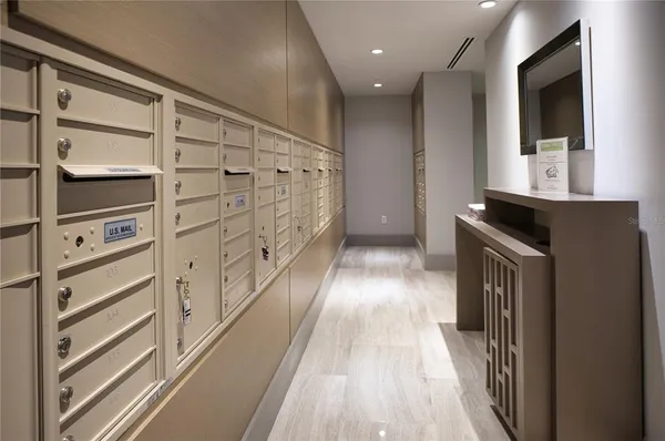 a view of walk in closet with wooden floor