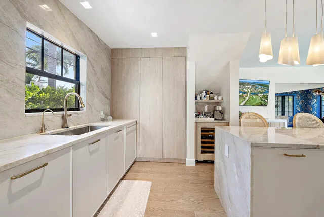 a kitchen with a sink and cabinets