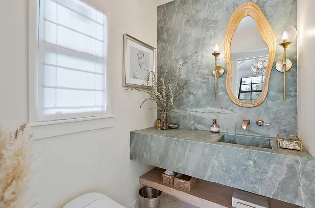 a view of a hallway with wooden floor and a large window