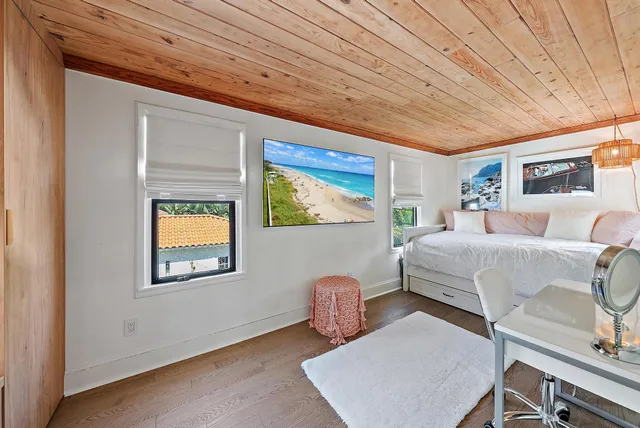 a view of a house with swimming pool and a yard