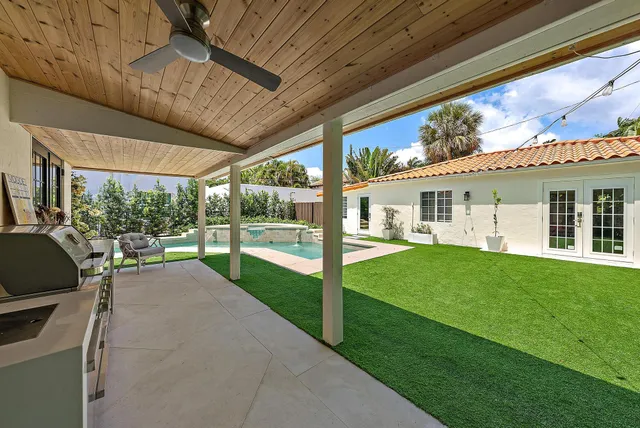 a living room with furniture wooden floor and a rug