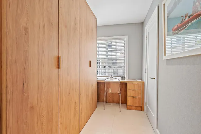 a bathroom with a sink a mirror and shower
