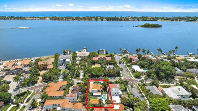 an aerial view of a house with a lake view