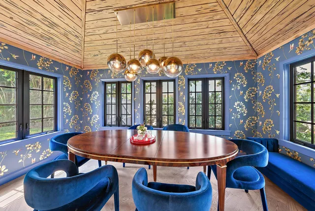 a outdoor dining space with furniture and wooden floor