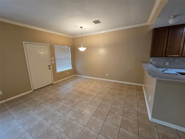 a kitchen with a sink a stove cabinets and a refrigerator