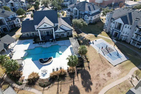 an aerial view of a house with swimming pool