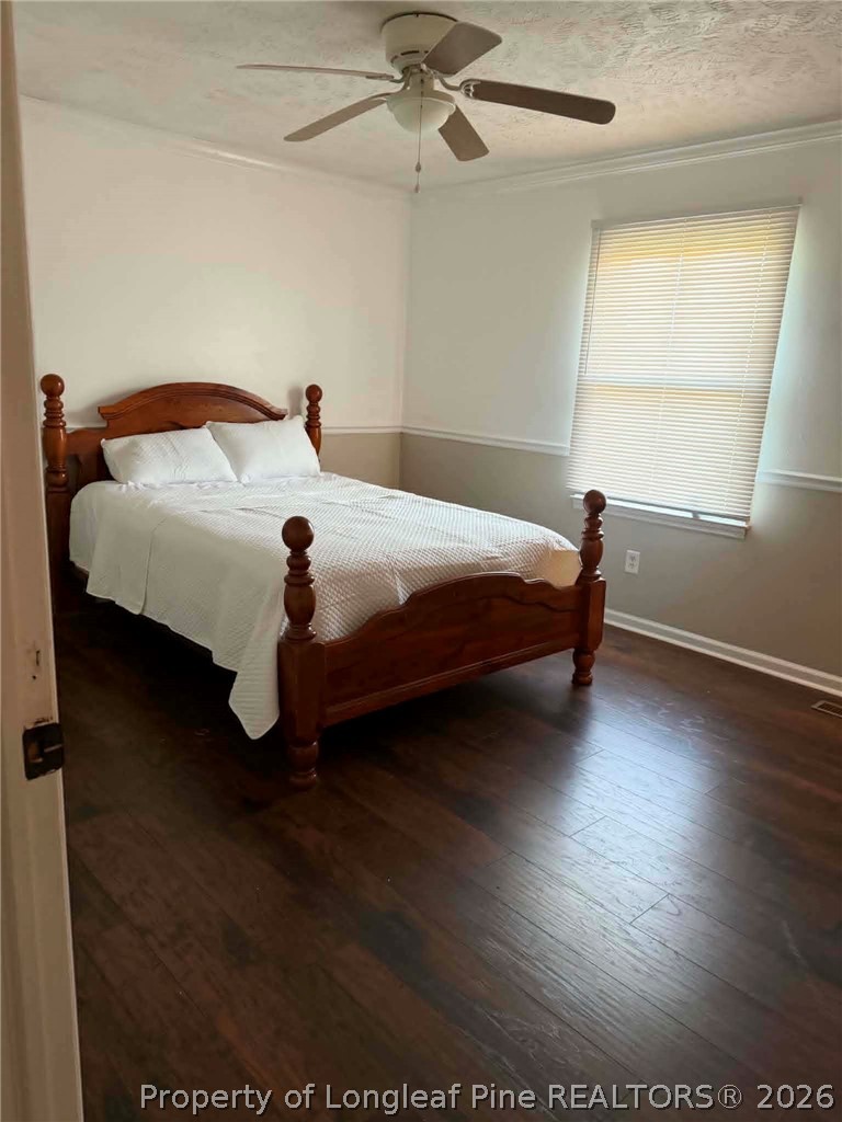 634 Dallas Road Lumberton, NC 28358 - Photo 15 of 27 a bedroom with a bed and window