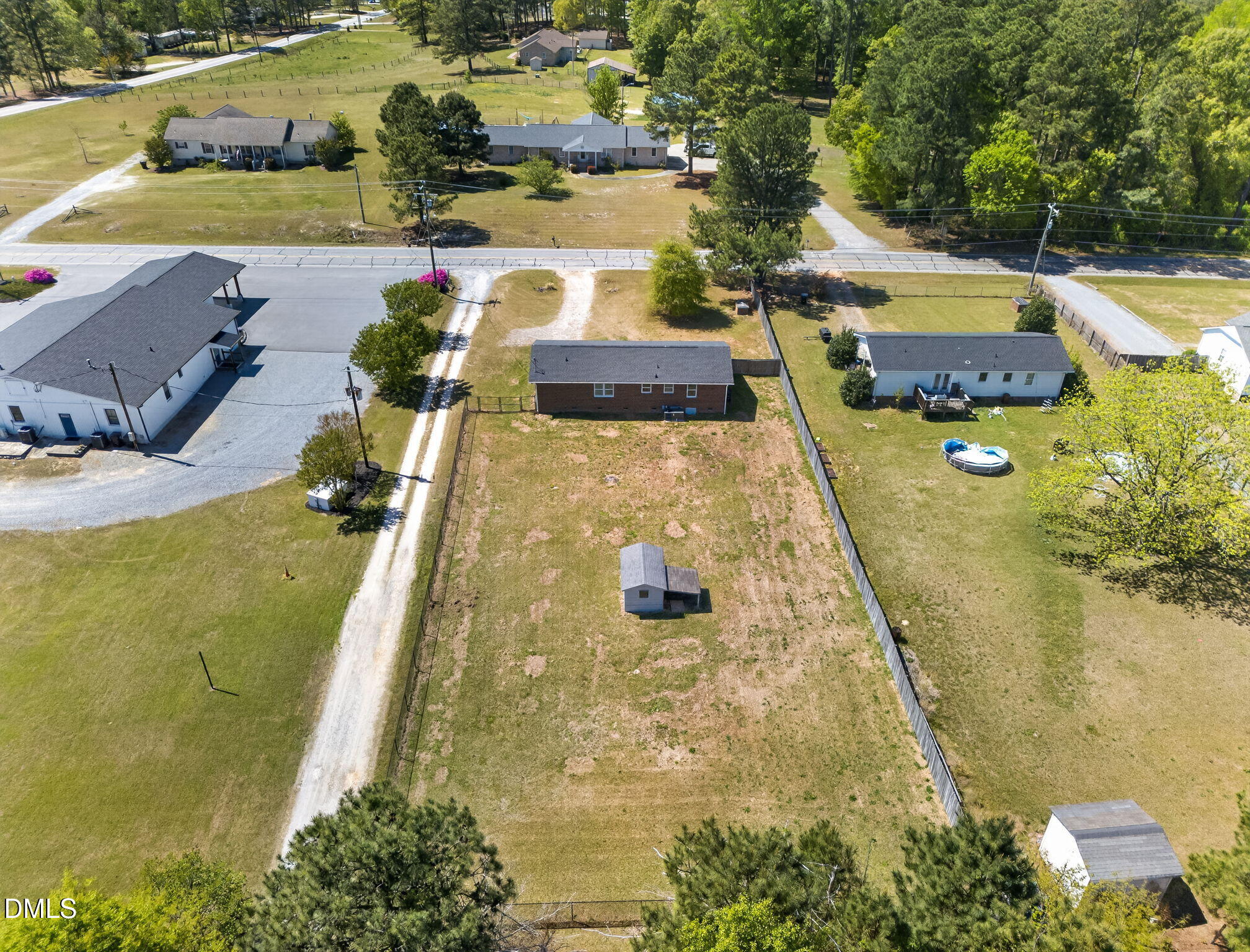 6086 Red Hill Church Road Coats, NC 27521 - Photo 39 of 44 a aerial view of a house with swimming pool