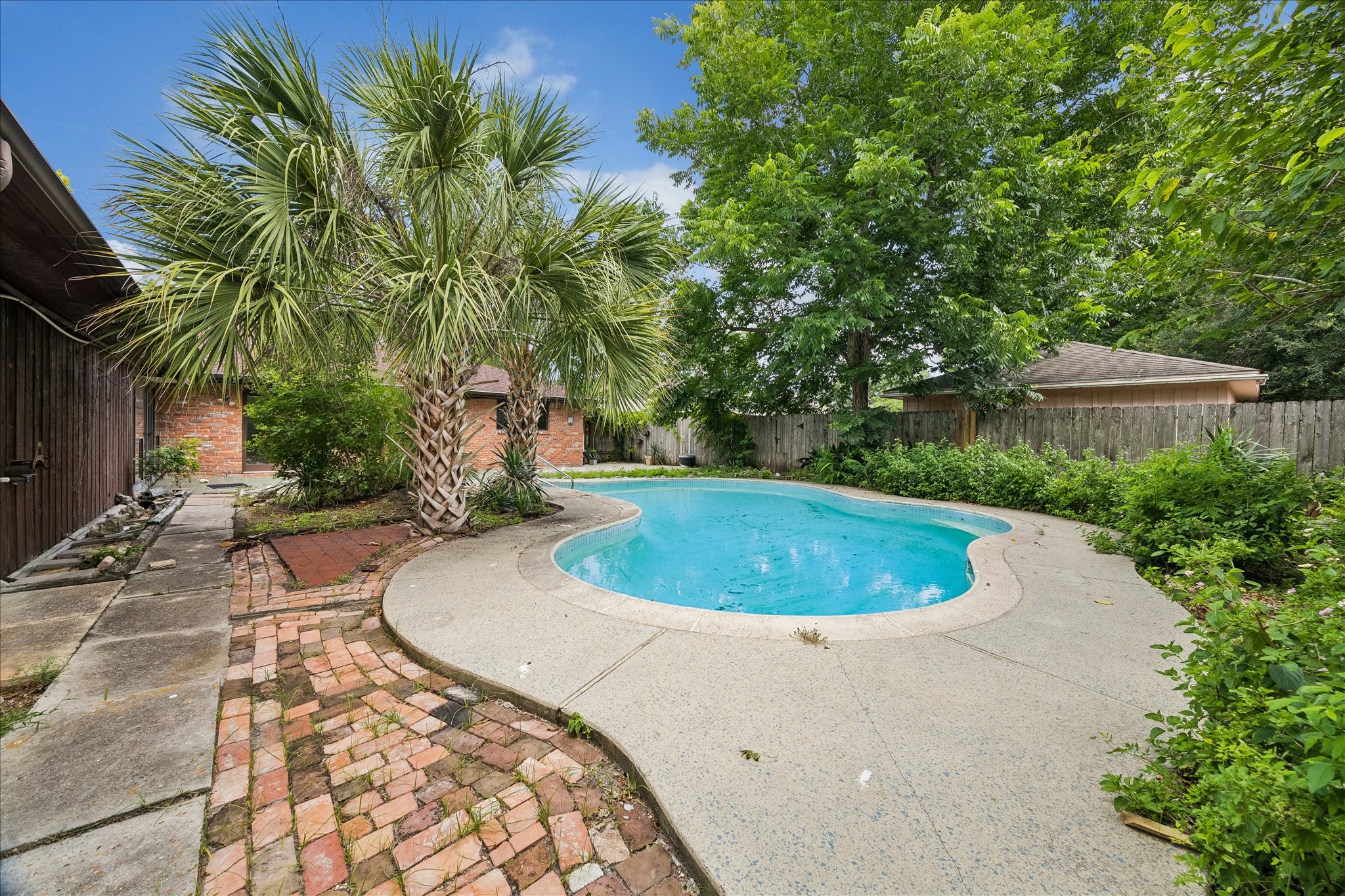3314 Tanglewilde Street Houston, TX 77063 - Photo 8 of 23 Beautifully maintained backyard with mature trees providing nice shade on those extra HOT Houston Summer Days!