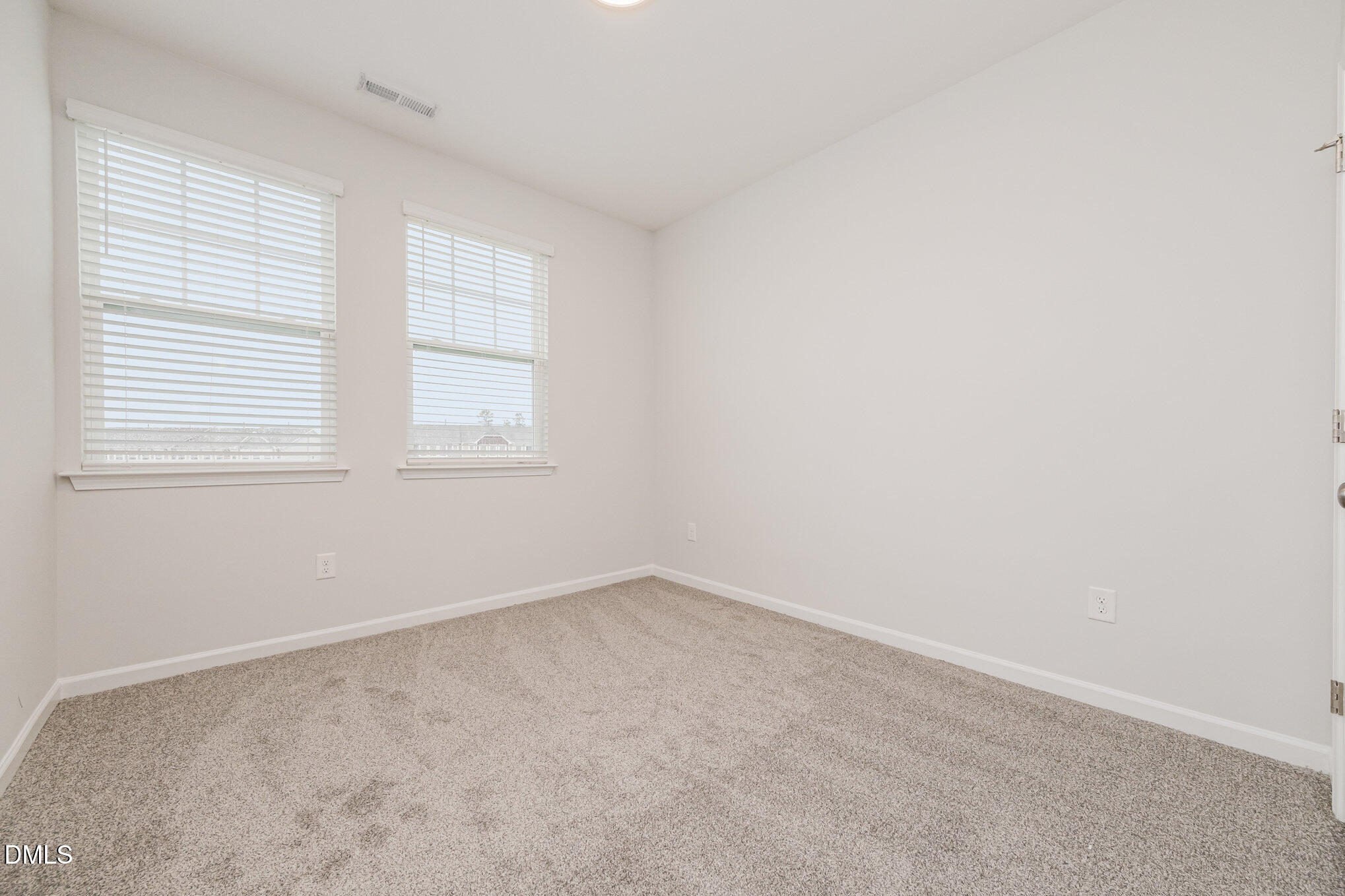 1019 Islip Place Durham, NC 27703 - Photo 12 of 18 an empty room with a window