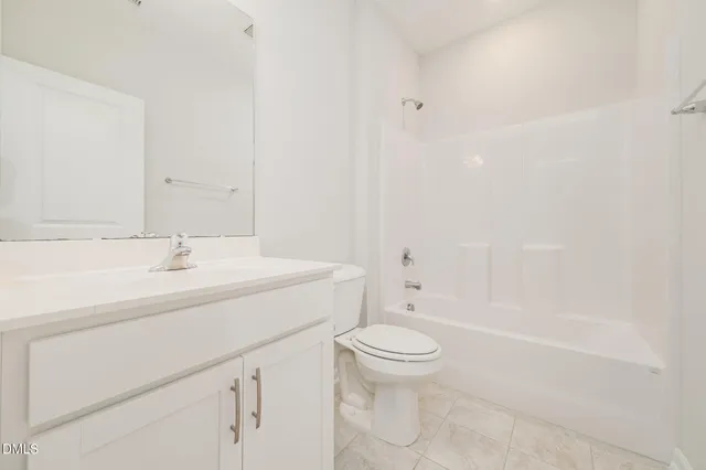 a bathroom with a sink a toilet and a bathtub