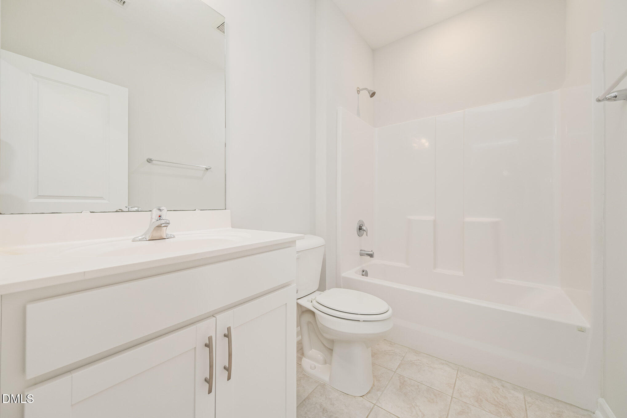 1019 Islip Place Durham, NC 27703 - Photo 15 of 18 a bathroom with a sink a toilet and a bathtub