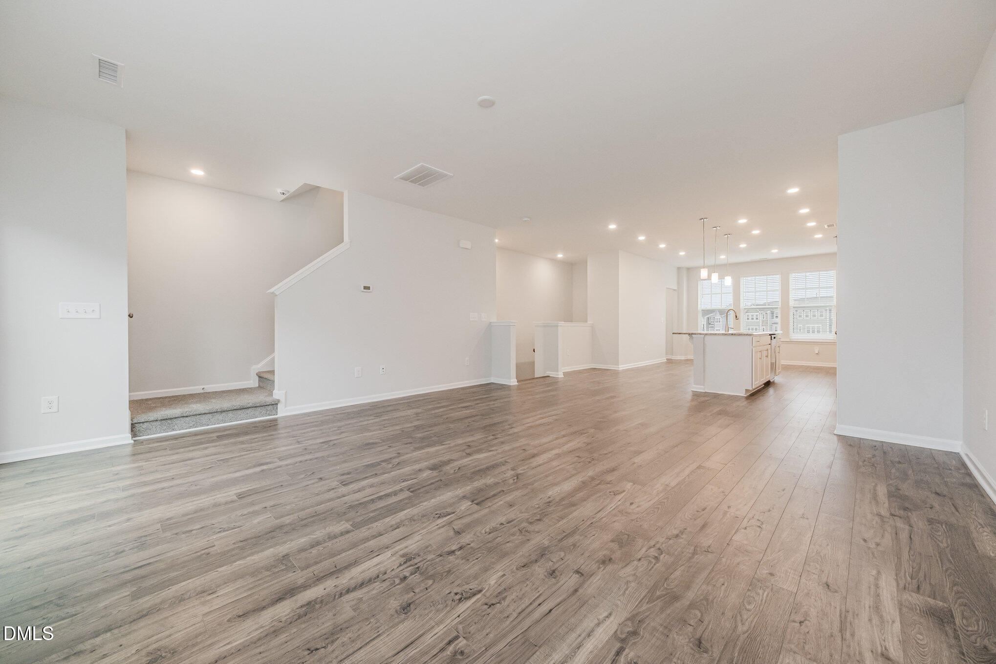 1019 Islip Place Durham, NC 27703 - Photo 5 of 18 a view of an empty room and a kitchen